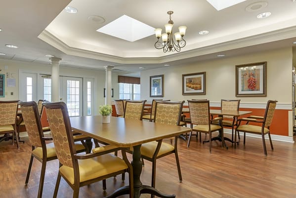 Bright and spacious dining area with tables and chairs