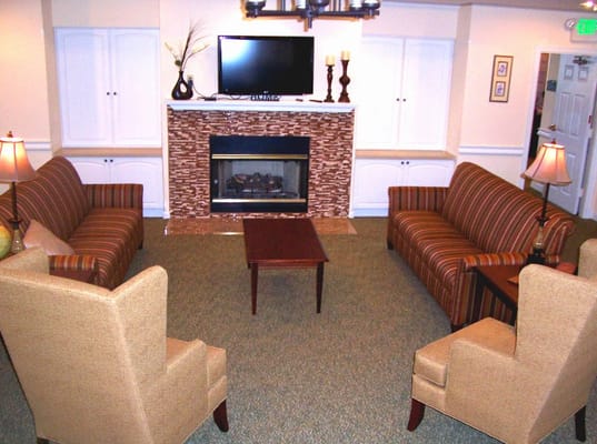 Cozy common area with seating and fireplace