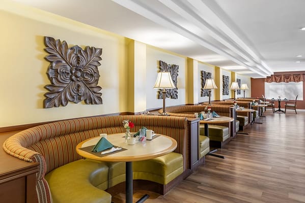 A cozy dining area with booths and decorative elements