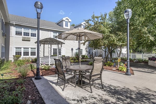 Outdoor seating area with tables and umbrellas