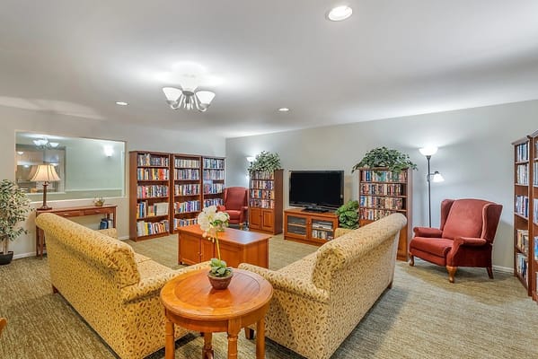 Cozy common area with bookshelves and seating