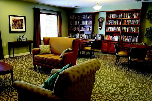 Bright common area with bookshelves and seating