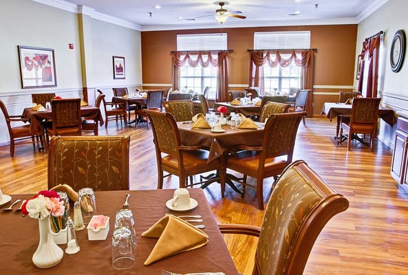 Dining area with neatly set tables and chairs