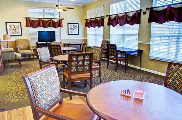 Bright common area with tables and chairs