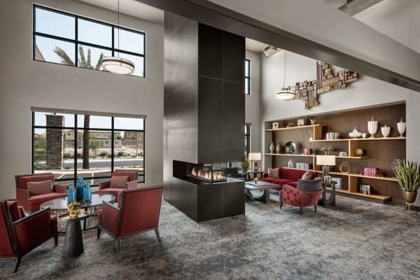 Modern lobby with seating and fireplace