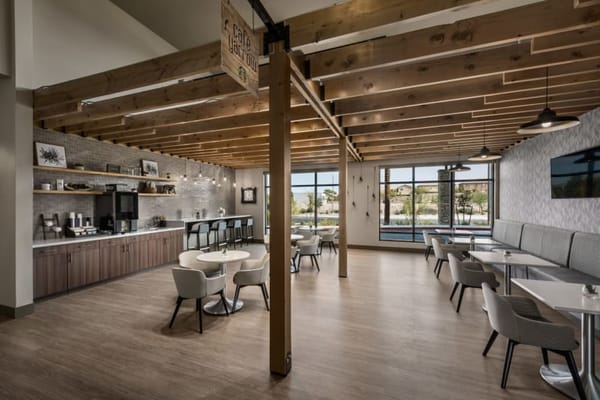 Modern café area with wooden beams and seating