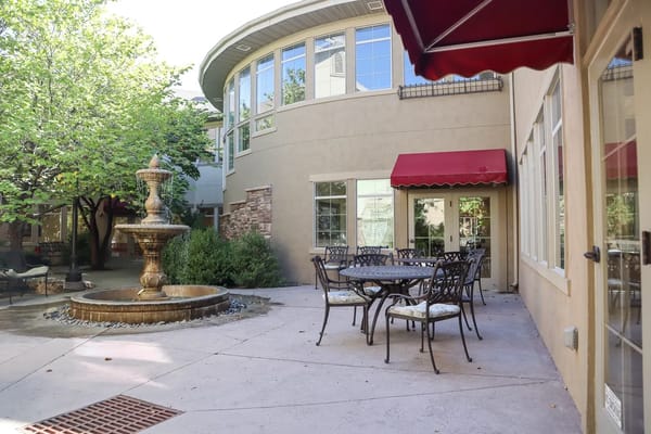Outdoor courtyard with fountain and seating area
