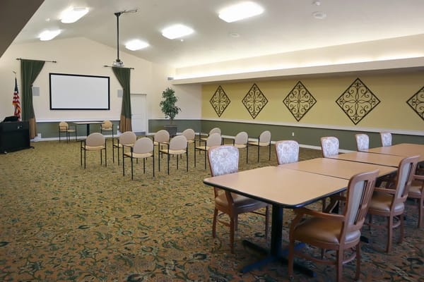 Interior view of a common area with chairs and tables