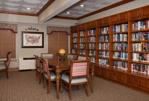 Cozy library with wooden shelves filled with books