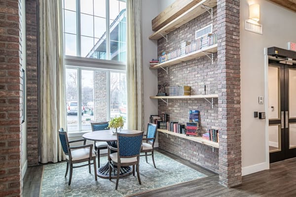 Bright and welcoming common area with seating and bookshelves
