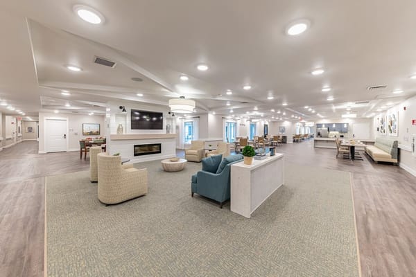Bright common area with seating and dining
