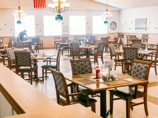 Dining room with tables arranged for residents