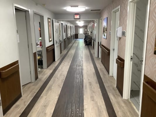 Empty hallway with rooms on either side