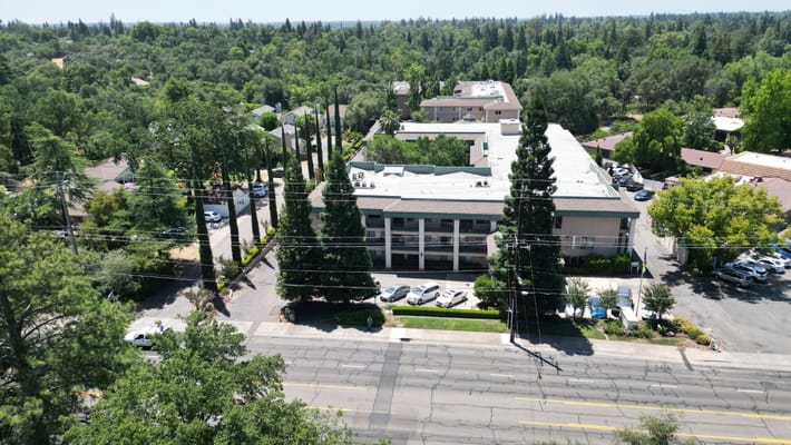 Aerial view of Atria Carmichael Oaks facility and surrounding area