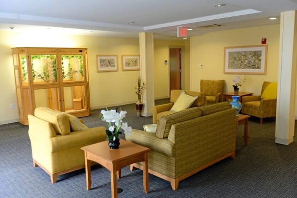 Comfortable seating area with yellow chairs and floral decor