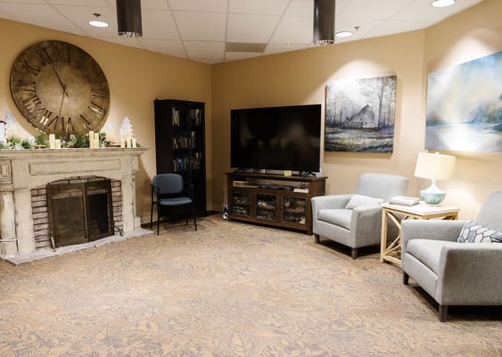 Comfortable living room with fireplace and artwork