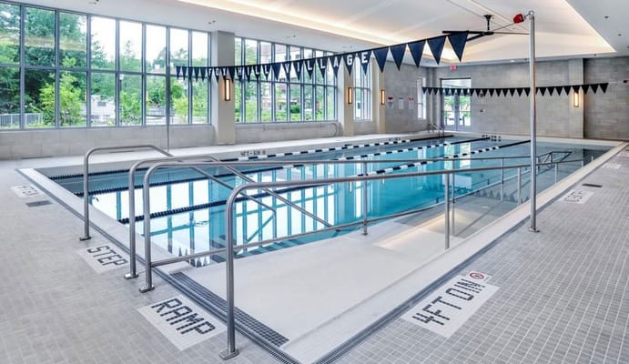 Indoor swimming pool area with large windows