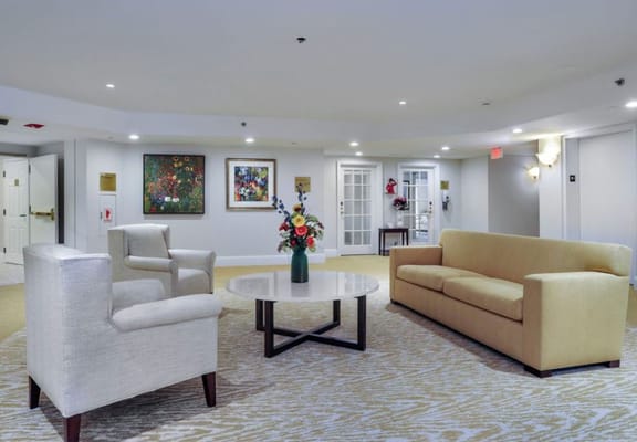 Cozy common area with comfortable seating and artwork