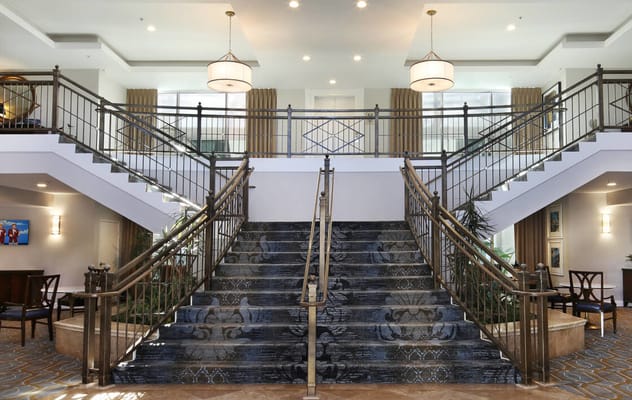 Interior view of a spacious lobby with a staircase