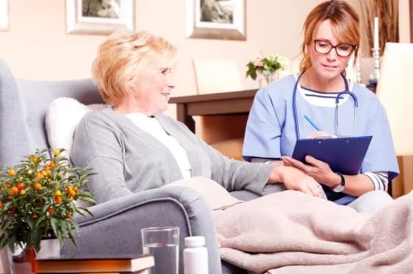 Caregiver interacting with resident in a cozy interior