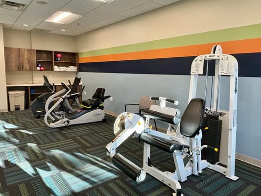 Independent living facility gym with exercise equipment