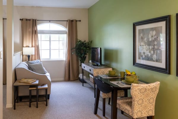 Cozy interior of a resident room with living and dining area