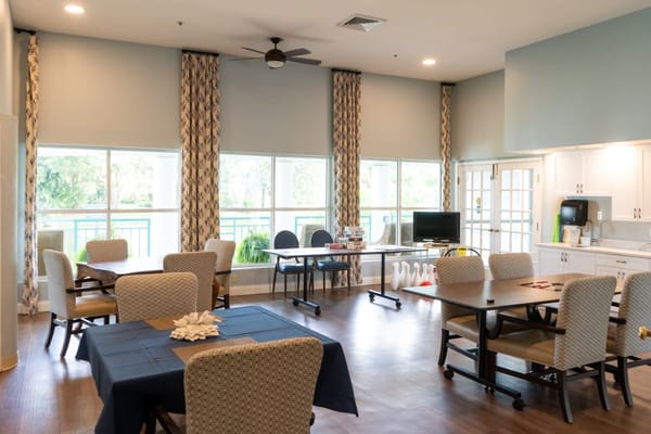 Bright common area with tables and chairs