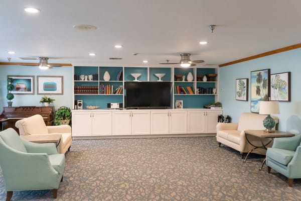 Bright common area with seating and a television