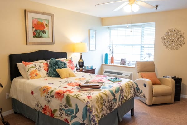 Cozy private room with floral bedding and natural light