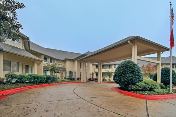 Exterior view of Holiday Andover Place with landscaping