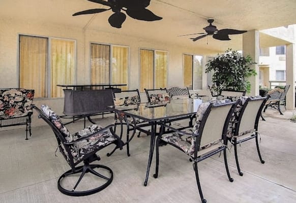 Outdoor dining area with tables and chairs