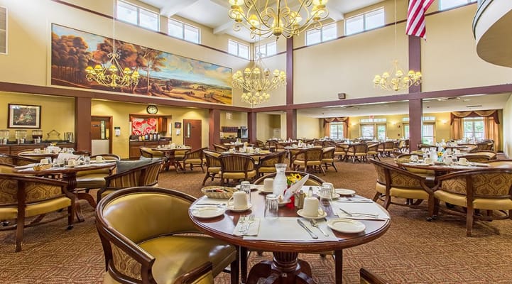 Dining area with tables set for residents