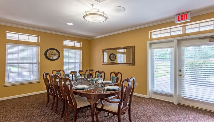 Dining room with a large table set for a meal