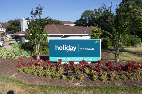 Sign for Holiday Virginian with landscaping