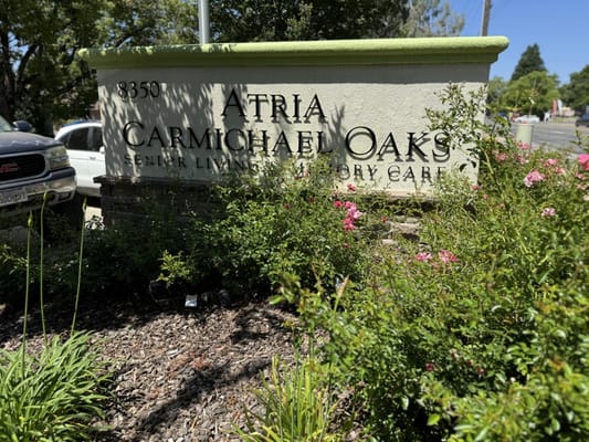 Signage for Atria Carmichael Oaks with landscaping