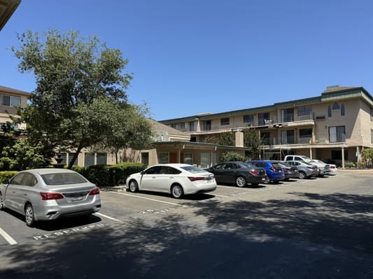 Exterior view of the facility with parking and landscaping