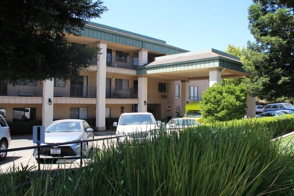 Exterior view of Atria Carmichael Oaks building entrance