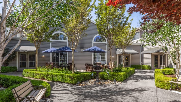 A beautifully landscaped courtyard with outdoor seating