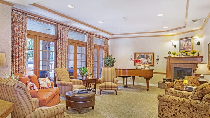 Cozy common area with comfortable seating and piano