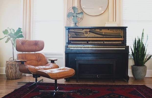 Cozy interior with a chair and piano