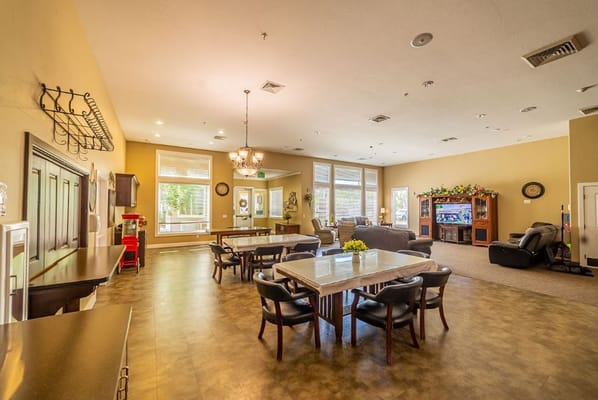 Bright common area with tables and seating