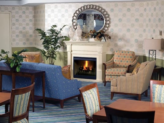 Comfortable living room with seating and a fireplace