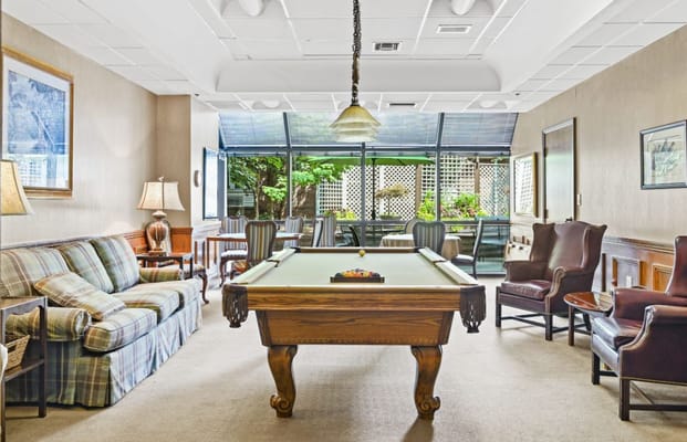 Common area with billiard table and lounge seating