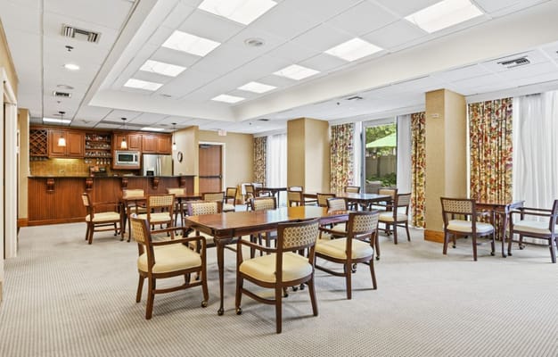 Bright dining area with tables and chairs