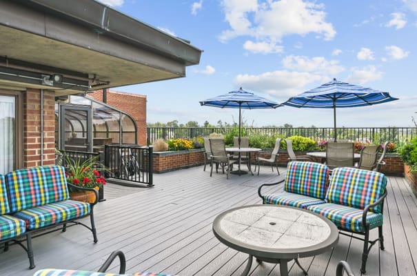 Outdoor terrace with seating and umbrellas