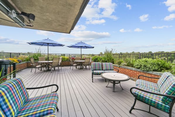 Outdoor terrace with seating and umbrellas