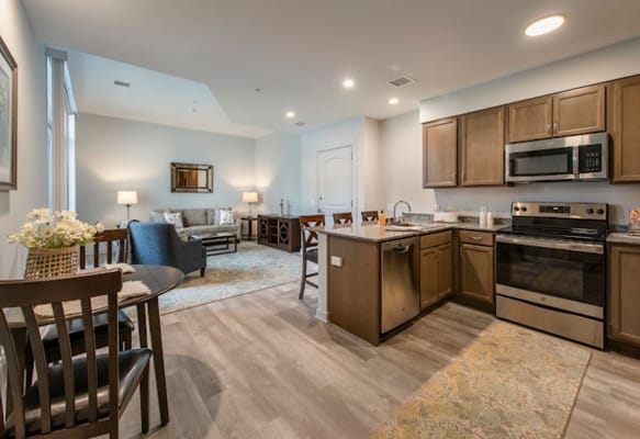 Modern kitchen and living area in a resident's suite
