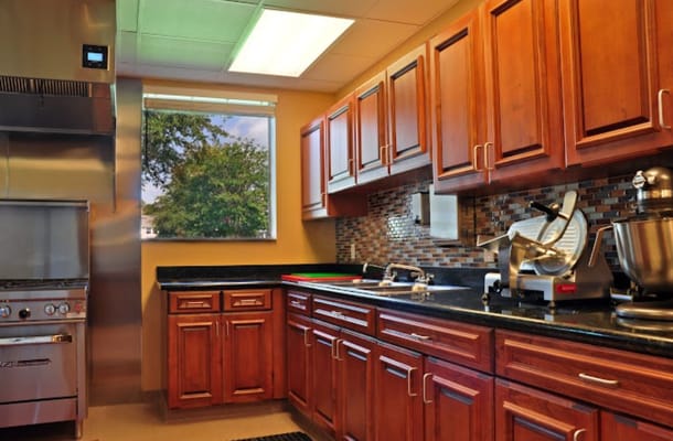 Well-equipped kitchen with wooden cabinets and appliances