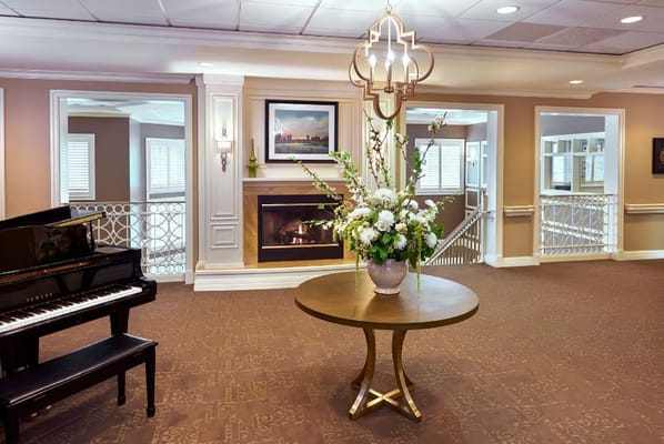 Piano and floral arrangement in the lobby
