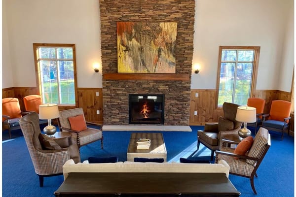 Cozy common area with seating and a fireplace